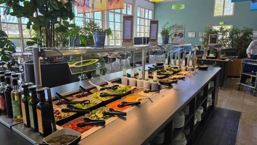 a buffet line with many different types of food at Sportschule Oberhaching in Oberhaching