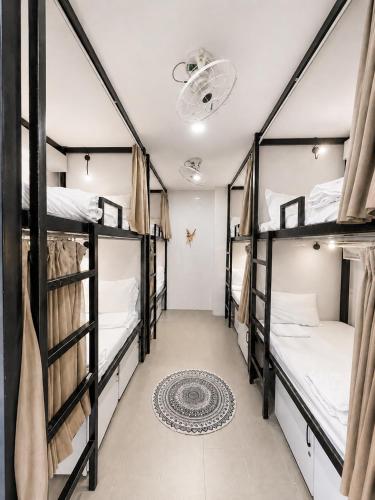 a group of four bunk beds in a room at Lacasa Homestay in Hue