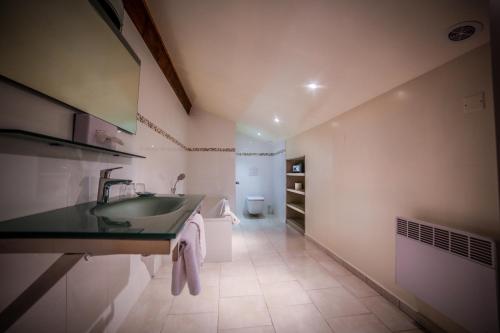 a bathroom with a sink and a toilet at Castellu Rossu in Lucciana