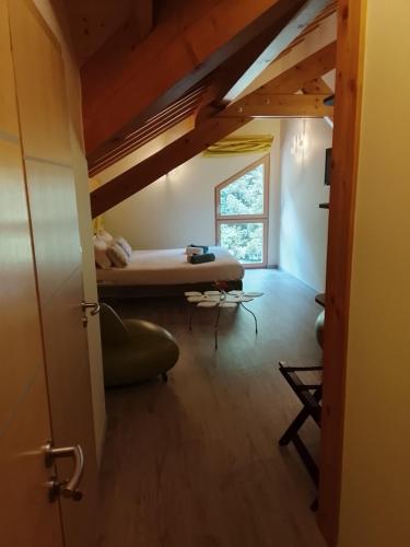 a bedroom with a bed and a window in a room at Compagnie des gites de luxe in Gérardmer