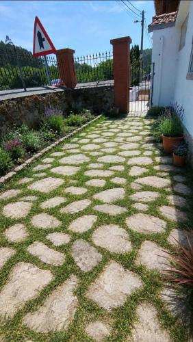 a stone walkway in front of a building at La Casona de Carcedo 3 in OVD