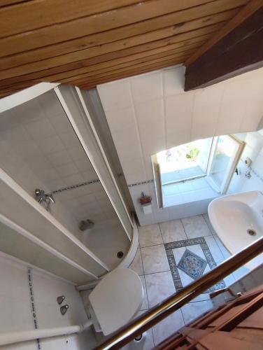 an overhead view of a bathroom with a sink and a toilet at Casa di Rose in Vrsar