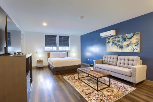 a living room with a bed and a couch at Sweet Stay in Hershey