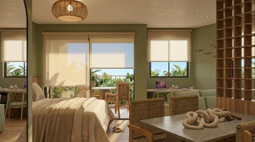 a bedroom with a bed and a dining room with windows at Porto Beach Resort - Marulhos in Porto De Galinhas