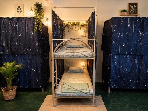 a room with two bunk beds and a mirror at F1 Riverside Mee Udang in Malacca