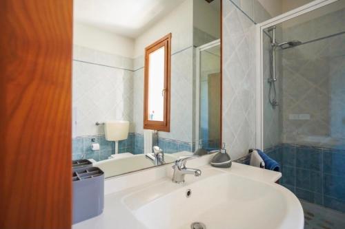 a bathroom with a sink and a mirror at Casa Stella Marina in Cervia