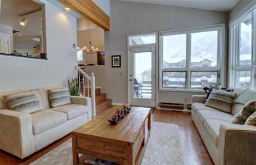 a living room with two couches and a coffee table at Woods12 Townhome Pet Friendly in Copper Mountain