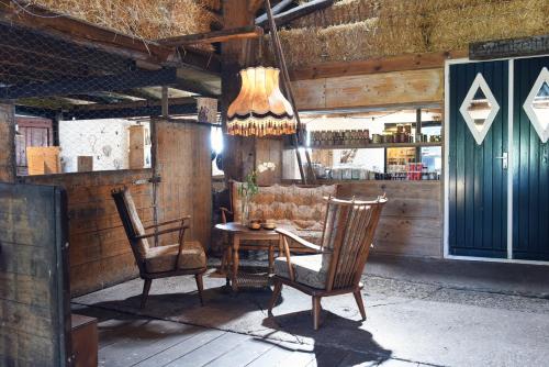 a dining room with a table and two chairs at Smuk Grutte Bell Tent nabij het water in Friesland in Echtenerbrug