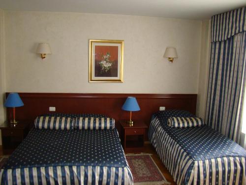 Posteľ alebo postele v izbe v ubytovaní Hotel Vila Ariston