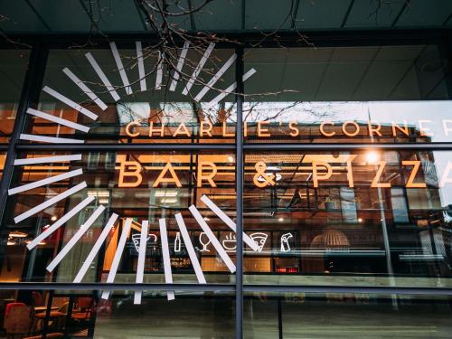 a store front with a large sign in the window at ibis Belfast City Centre in Belfast