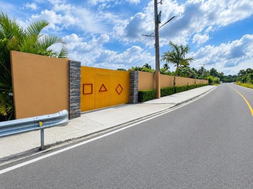 a fence on the side of a road at Villa la Santa, piscina infinita - Jacuzzi in Higuey