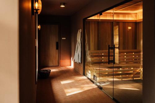 a hallway with a glass door to a room at New Paltz Way Hotel in New Paltz