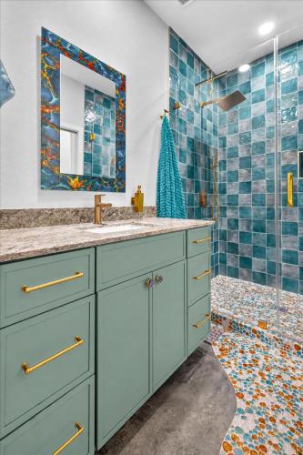 a bathroom with a sink and a shower at Ninas Villas - Brand New Luxury Villas in Galveston