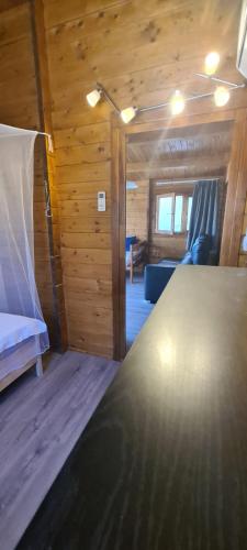 a bedroom with a bed and a couch in a room at O Meu Retiro in Carrapatelo