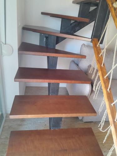 a group of wooden shelves in a room at Apartman 4 sa spavacom in Zelenika