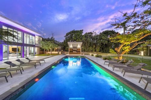 a swimming pool in the backyard of a house at Luxury 9-Bedroom Villa in Southwest Ranches with Private Pool, Jacuzzi, and Movie Theater, Sleeps 20 in Miami