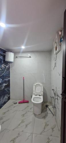 a bathroom with a toilet in a room at Inder's Heritage in Bangīna