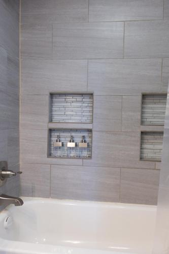 a bathroom with a sink and two windows at Yellow Gate Executive Retreat in San Jose