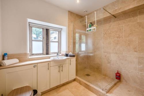 a bathroom with a sink and a shower at 7 Bed in Langbar oc-d34075 in Middleton