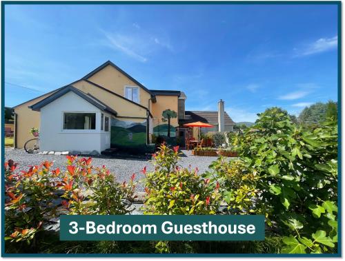 a house with a garden with the words bedroom guest house at Mon Petit Cottage - B&B and Guest House in Bunclody in Bunclody