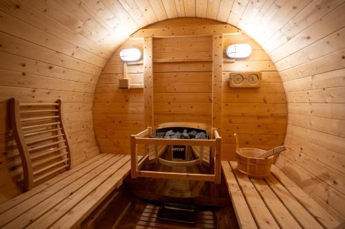 an inside view of a sauna in a wooden cabin at Aurum Cabins in Zlatibor