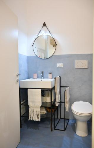 a bathroom with a sink and a toilet at Dimora San Vito in Lequile