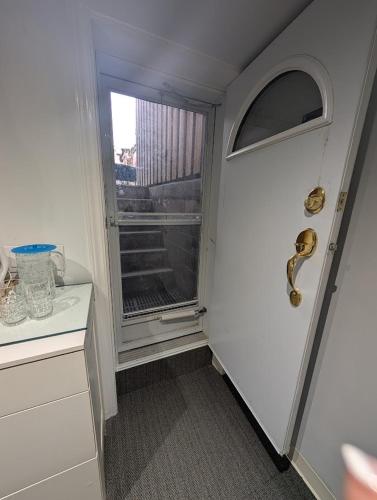 a hallway with a door and a window in a room at King Size In-Suite Basement in Toronto