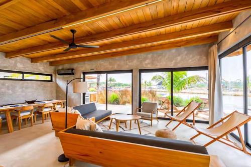 a living room with a couch and a table at Seabird Villa 11 in Placencia