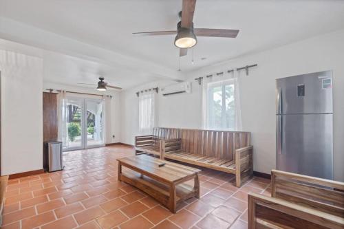 a living room with a couch and a table at Casa Edie in Placencia
