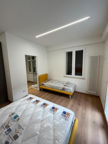 an empty room with a bed and a couch at mama house in Marotta