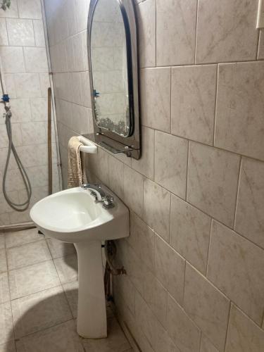 a bathroom with a sink and a mirror on the wall at La casita in Pringles