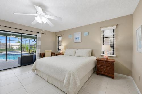 a bedroom with a bed and a ceiling fan at 830 Coronado in Punta Gorda