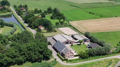 an aerial view of a large house with a farm at Hoeve Tramzicht in Hellevoetsluis