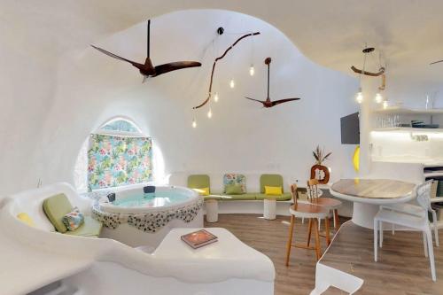 a living room with a tub in the middle at Dolphin @ Swan Villas in Maya Beach