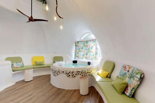 a room with a table and chairs and a window at Dolphin @ Swan Villas in Maya Beach