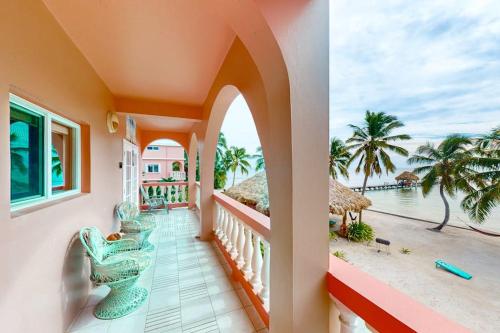 a balcony of a house with a view of the ocean at Palm @ Caribe Island in San Pedro
