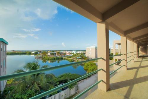 a balcony with a view of a body of water at Suite E303 Mara Laguna in San Pedro