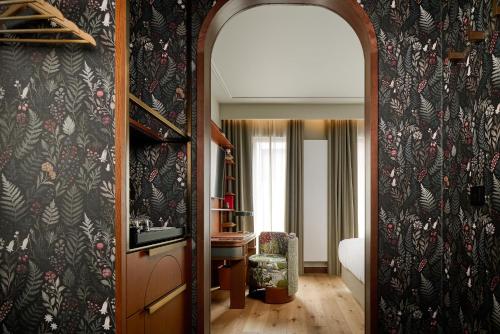 a hallway leading to a room with a room with a room at Skald Hotel Akureyri, Curio Collection By Hilton in Akureyri