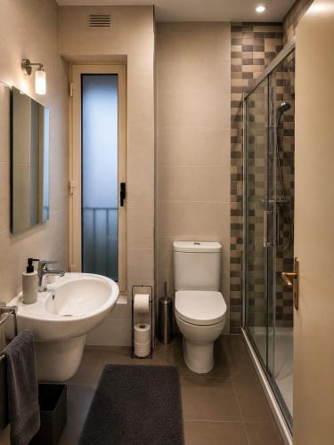 a bathroom with a toilet and a sink and a shower at Sliema central apartment in Sliema