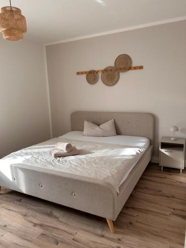 a bedroom with a white bed with a white mattress at Ferienhaus Lounis in Bützow
