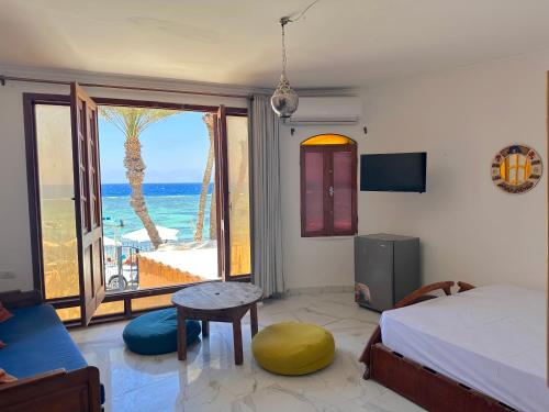 a bedroom with a bed and a view of the ocean at Leonessa's Villa in Dahab