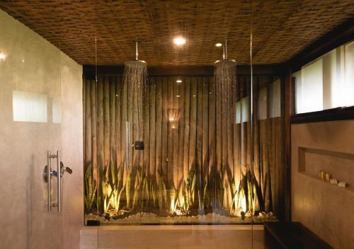 a bathroom with a shower with a curtain at Pousada Maravilha in Fernando de Noronha