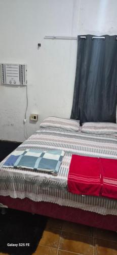 a bed sitting in a room with avertisement at HBTOUR Latin in Manaus