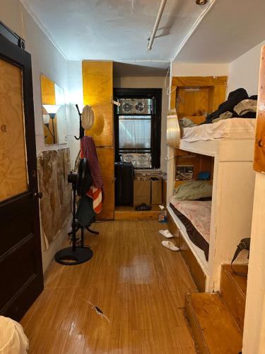 a room with two bunk beds and a camera at the Brooklyn Riviera in Brooklyn