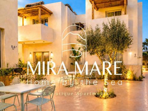 a house with a table in front of it at MIRA MARE - Apartment 5 in Stavros