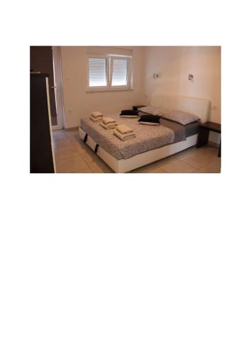 a room with two beds in a room at Villa Noah Apartement 2 in Novi Vinodolski