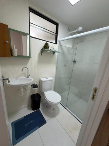 a bathroom with a shower and a toilet and a sink at Lunar Prime Aruana in Aracaju