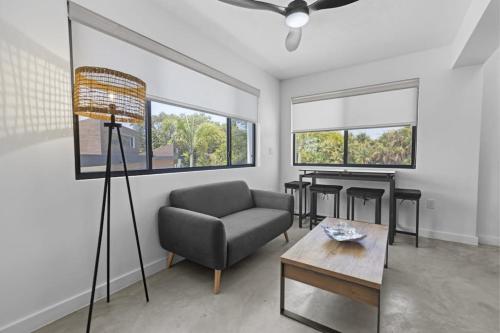 a living room with a chair and a table at Beyond the Blue Casita in Placencia