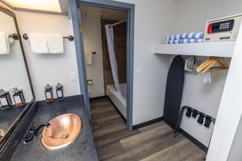 a bathroom with a sink and a bunk bed at Lake Powell Resort in Page