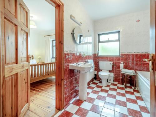 a bathroom with a sink and a toilet and a tub at 4 Bed in Inch oc-ii11636 in Caheracruttera